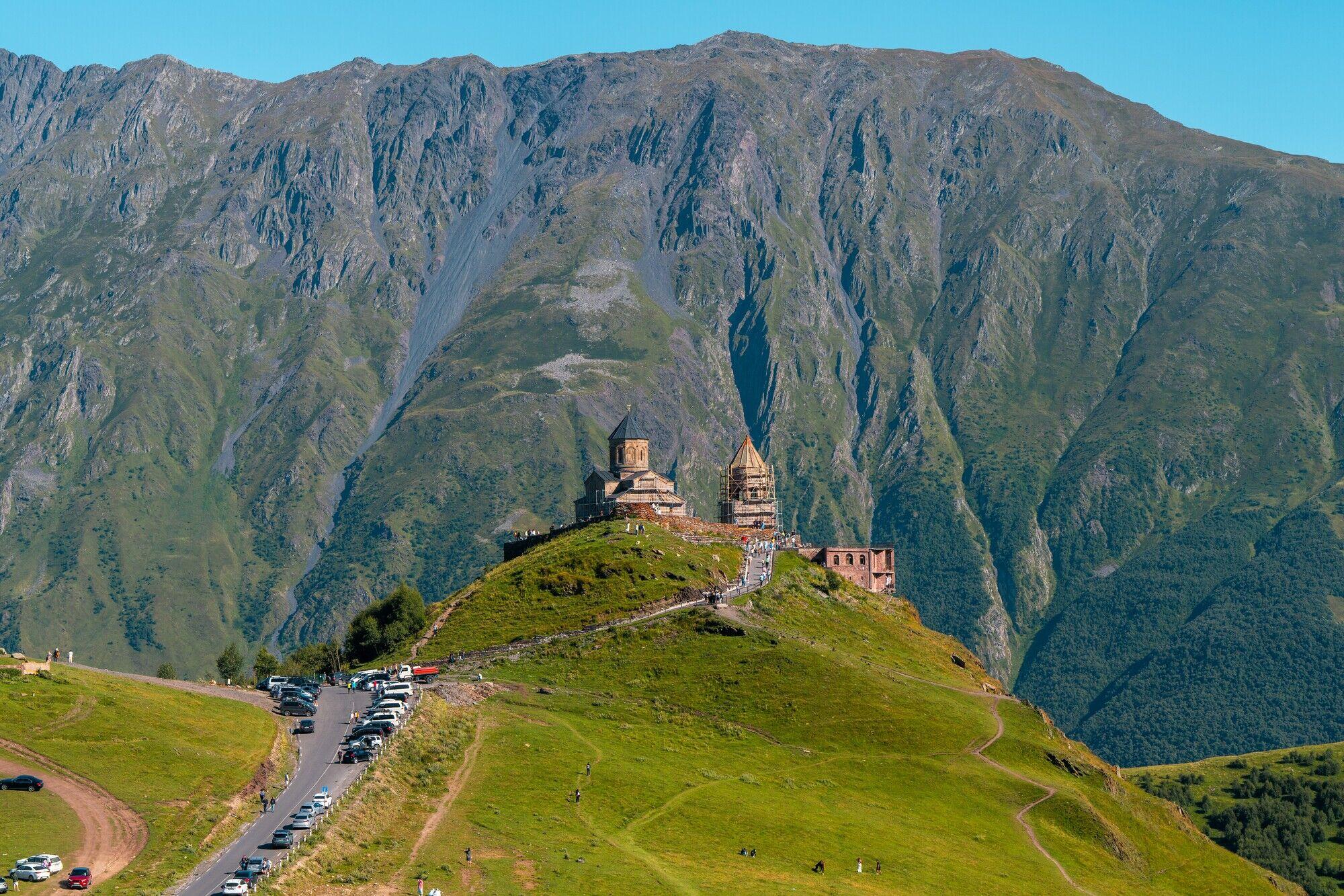 Mount Kazbegi with hiker in foreground